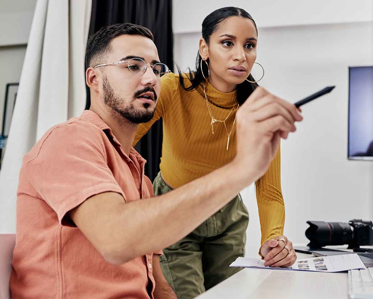Two hispanic designers at a creative agency